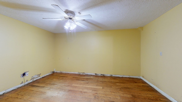 unfurnished room featuring a textured ceiling, ceiling fan, and hardwood / wood-style flooring