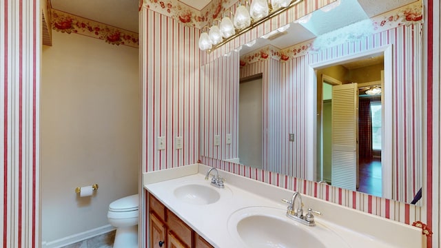 bathroom with vanity and toilet