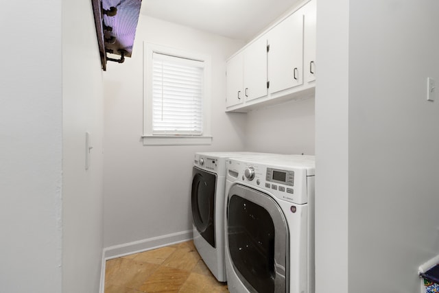 clothes washing area with cabinets and independent washer and dryer