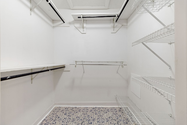 walk in closet featuring tile patterned floors