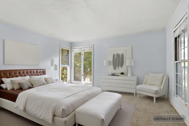 bedroom featuring ornamental molding and light colored carpet