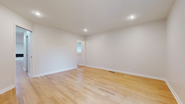 unfurnished room with light hardwood / wood-style floors