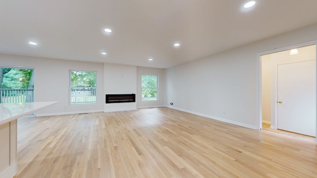 unfurnished living room featuring light wood-type flooring