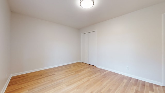 empty room with light wood-type flooring