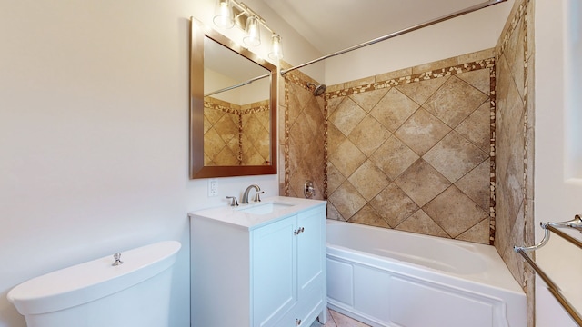 full bathroom with vanity, toilet, and tiled shower / bath