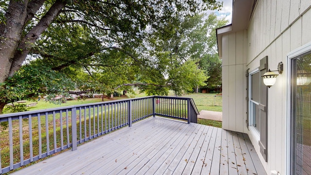 deck featuring a yard