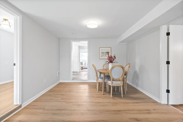 dining space featuring light hardwood / wood-style floors