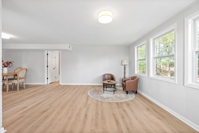 sitting room featuring light hardwood / wood-style flooring