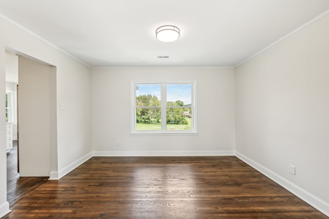 unfurnished room featuring crown molding and dark hardwood / wood-style floors