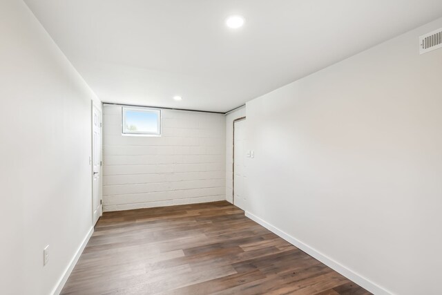 spare room with dark hardwood / wood-style floors