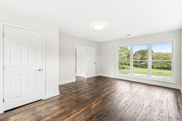 empty room featuring dark hardwood / wood-style floors