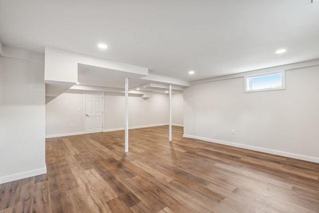 basement featuring hardwood / wood-style flooring