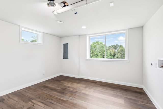 empty room featuring wood-type flooring and electric panel