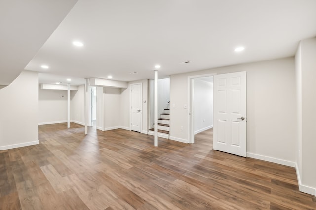 basement with hardwood / wood-style floors