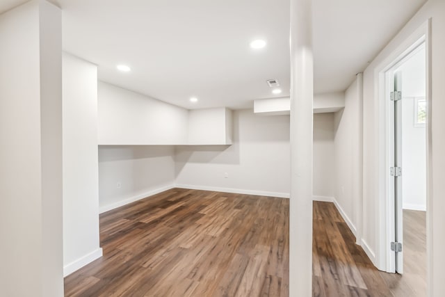 basement with dark wood-type flooring