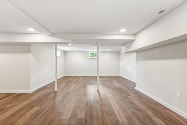 basement featuring wood-type flooring