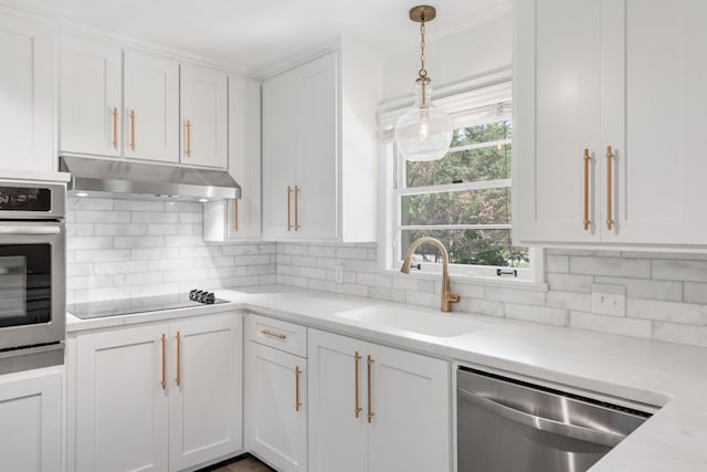 kitchen featuring stainless steel appliances, a healthy amount of sunlight, and white cabinetry