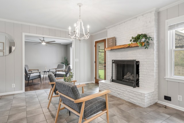 living room with a brick fireplace, tile patterned flooring, a healthy amount of sunlight, and crown molding