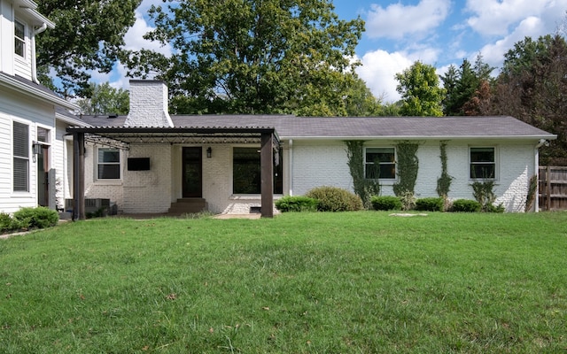 ranch-style home featuring a front yard