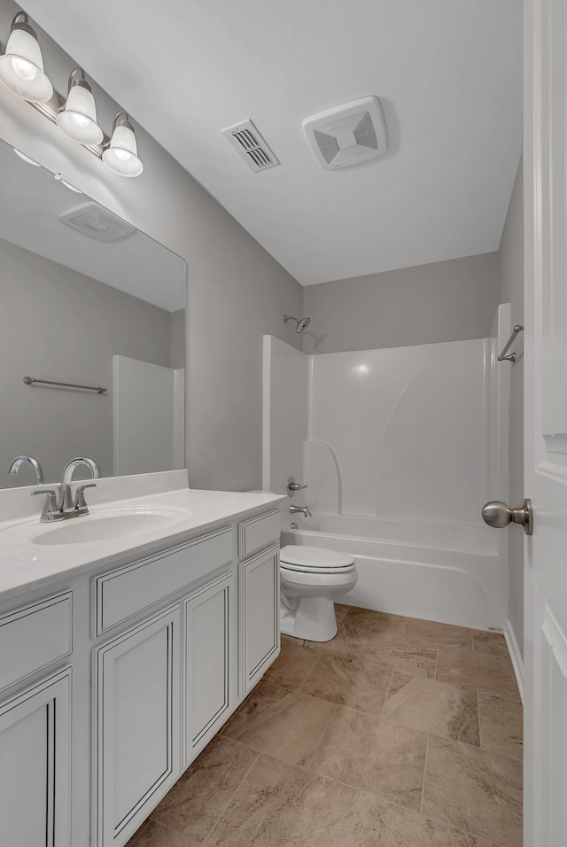 full bathroom featuring vanity, shower / bath combination, and toilet