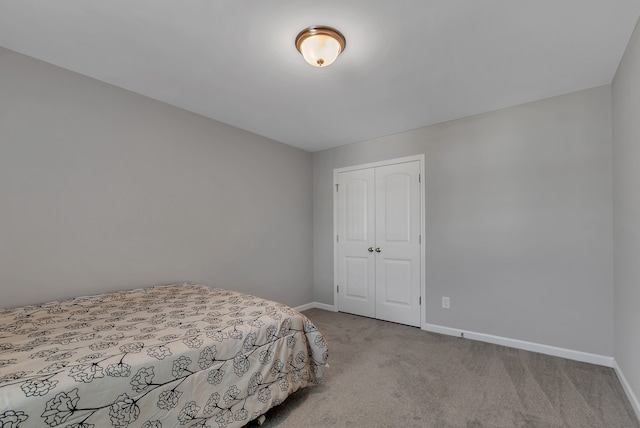 bedroom with light colored carpet and a closet