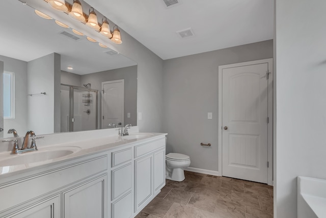 bathroom with a shower with door, vanity, and toilet