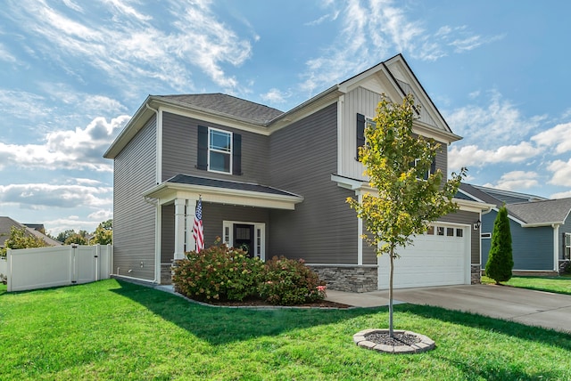 view of front of property with a garage and a front yard