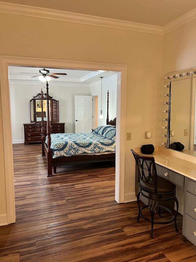 bedroom featuring ceiling fan, ornamental molding, built in desk, and dark hardwood / wood-style flooring