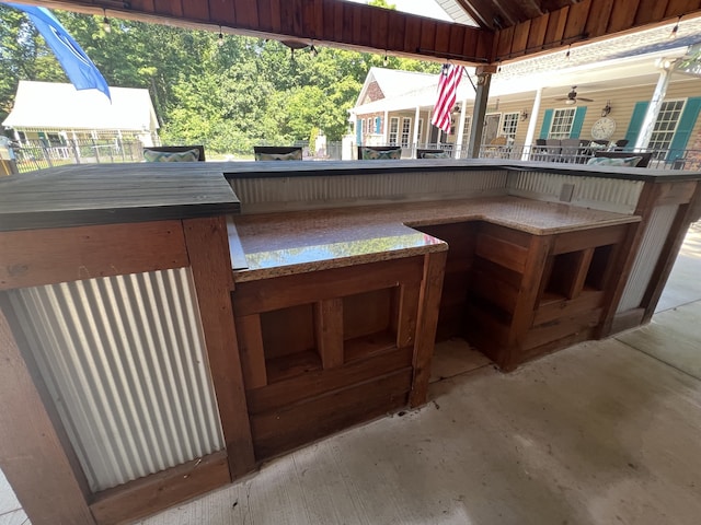 exterior space featuring exterior bar and ceiling fan