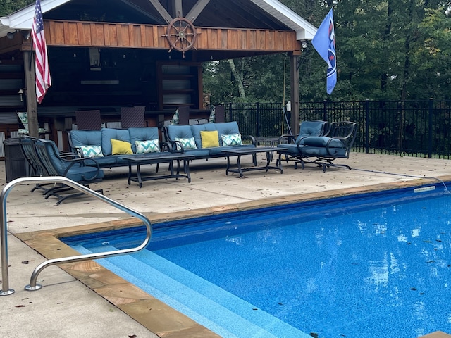 view of swimming pool with an outdoor hangout area and a patio area