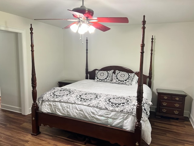 bedroom featuring ceiling fan and dark hardwood / wood-style floors