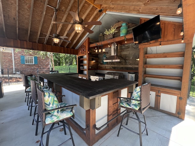 exterior space featuring vaulted ceiling, extractor fan, and a wealth of natural light