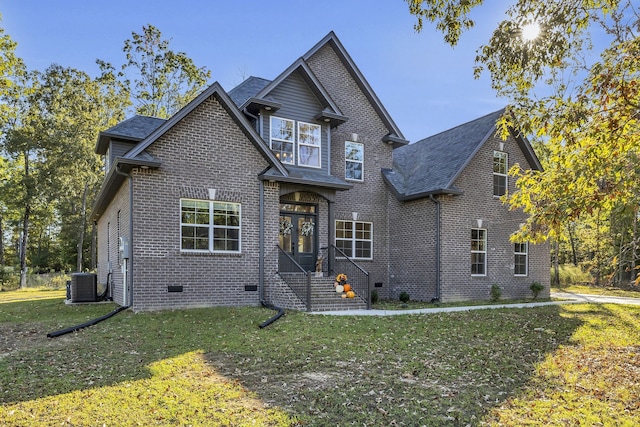 view of front of home with cooling unit and a front lawn