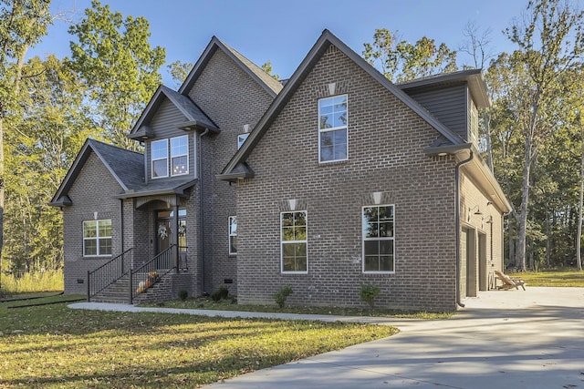 front facade featuring a garage and a front lawn