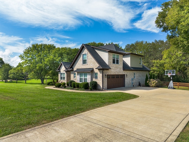 view of front of home featuring a garage and a front yard