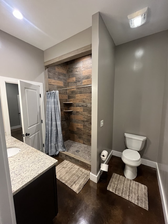 bathroom featuring concrete flooring, a shower with curtain, vanity, and toilet