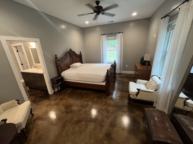 bedroom featuring ensuite bath and ceiling fan