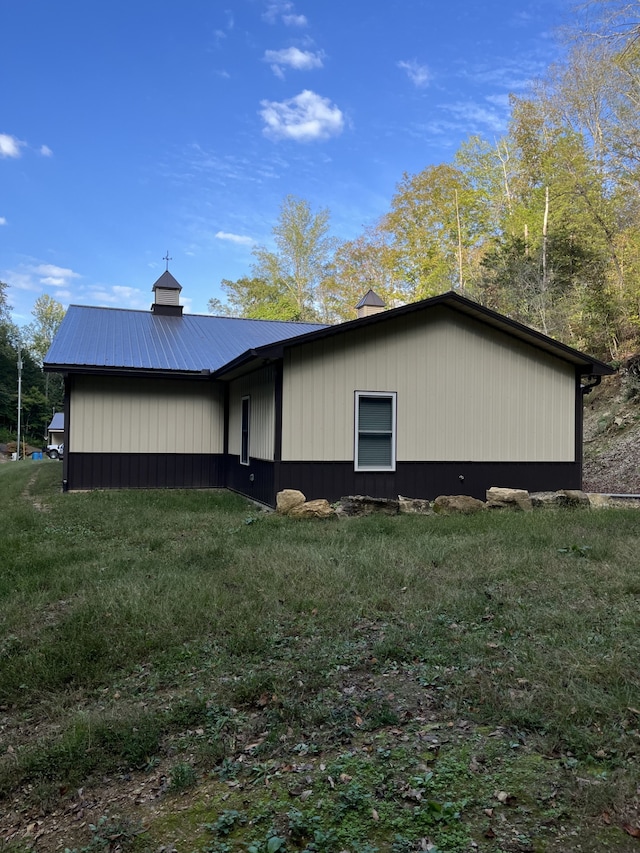 view of home's exterior featuring a lawn