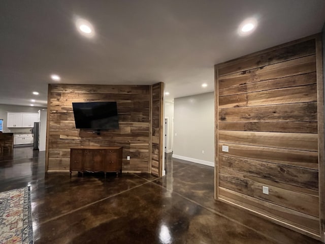 living room with wooden walls