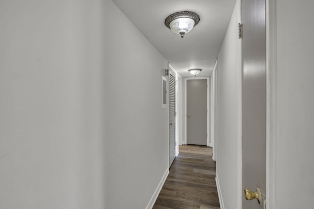 corridor featuring dark wood-type flooring