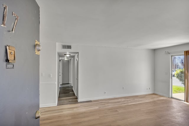 unfurnished room featuring light hardwood / wood-style floors