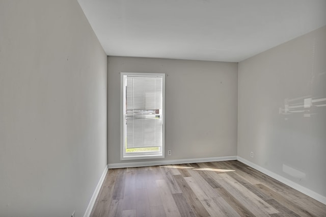 unfurnished room featuring light wood-type flooring