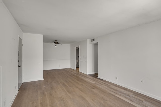 spare room with ceiling fan and light hardwood / wood-style floors