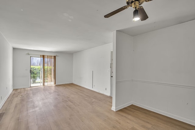 empty room with ceiling fan and light wood-type flooring