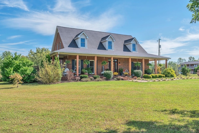 view of front of house featuring a front lawn and covered porch