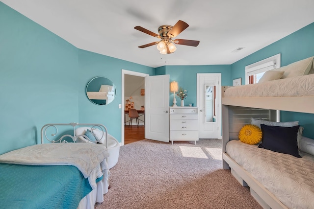 bedroom featuring light carpet and ceiling fan