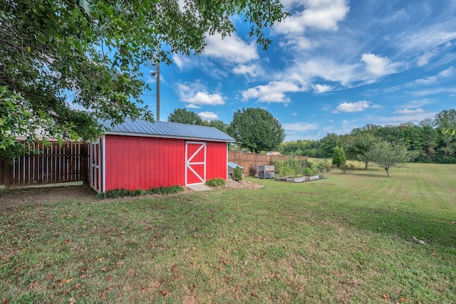 view of outbuilding with a yard