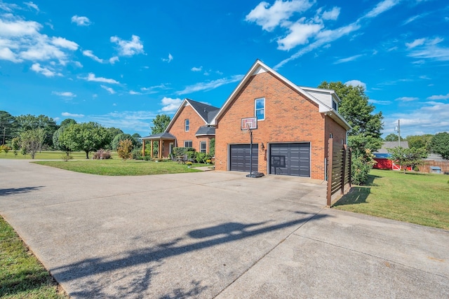 view of front of house with a front lawn and a garage