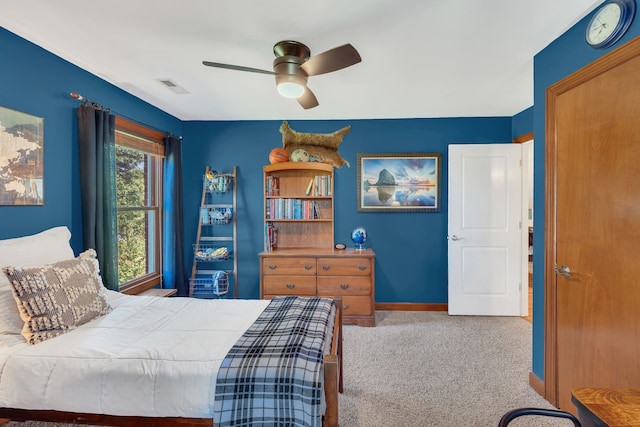 carpeted bedroom with ceiling fan