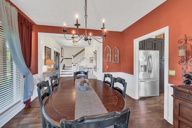 dining area with a notable chandelier and dark wood-type flooring